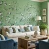 Green floral bird mural wallpaper with delicate white blossoms and perched birds, luxury botanical wall design in an elegant modern classic living room with teal sofa.