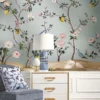 Pastel blue floral bird mural wallpaper with blooming branches, lemons, and elegant birds, luxury botanical wall design for classic bedroom or living space.