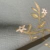 Premium sage green non-woven wallpaper with elegant gold botanical vines and delicate white floral pattern, perfect for living rooms, bedrooms, feature walls, nurseries, and luxury home interiors.