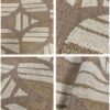 Casamance FILANDRA 7698 25 48 geometric textured wallpaper in warm beige and brown tones installed on a modern living room feature wall with premium designer interior décor.