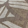 Casamance FILANDRA 7698 25 48 geometric textured wallpaper in warm beige and brown tones installed on a modern living room feature wall with premium designer interior décor.
