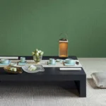 Luxury sage green vertical textured wallpaper with subtle linear fabric effect, Armani Casa inspired modern designer wallcovering for living room and bedroom interiors.